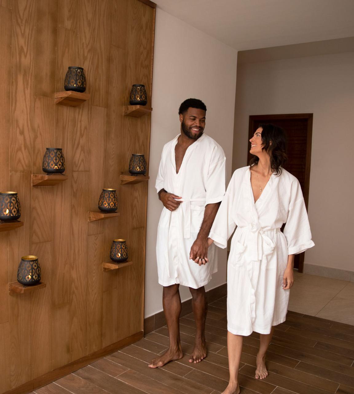 a couple walking in a spa room