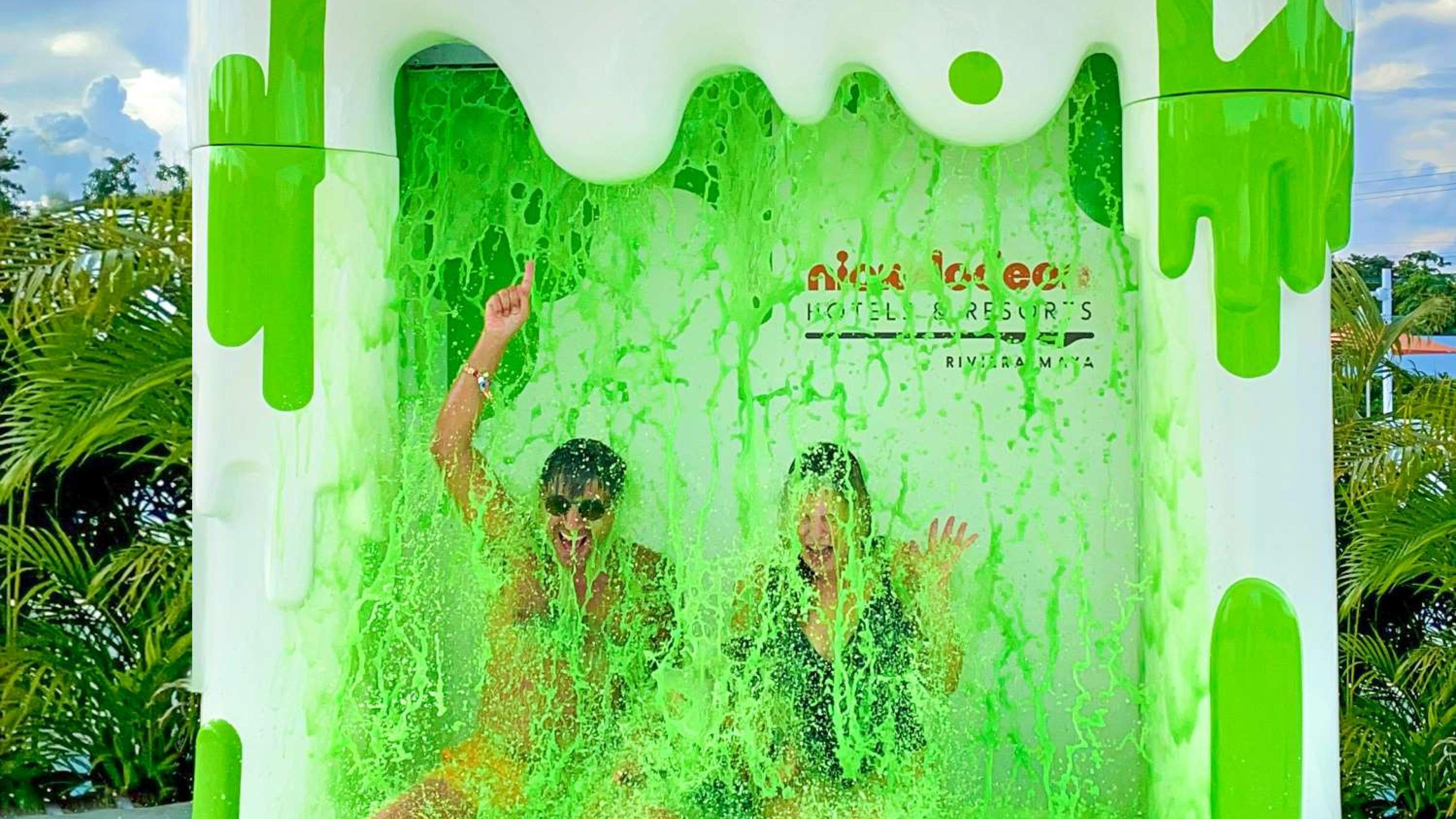 A couple getting covered in green slime