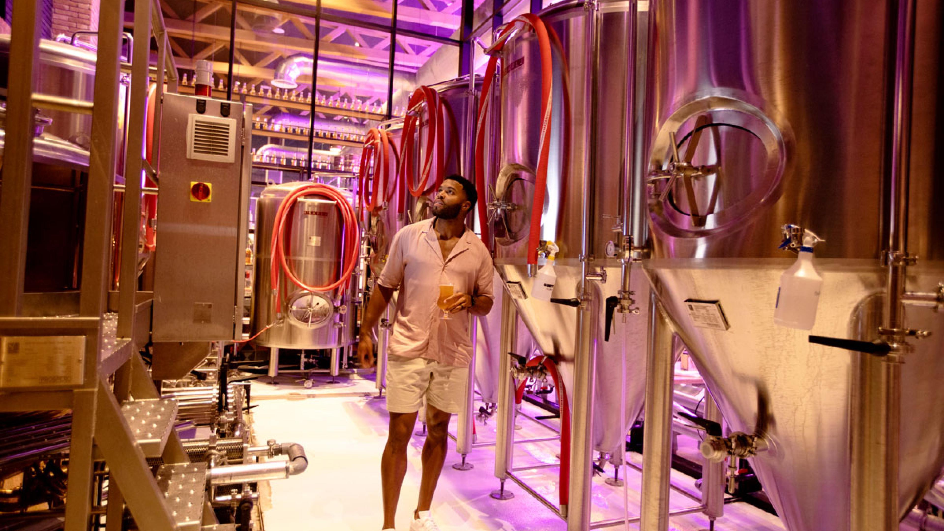a man walking in a brewery