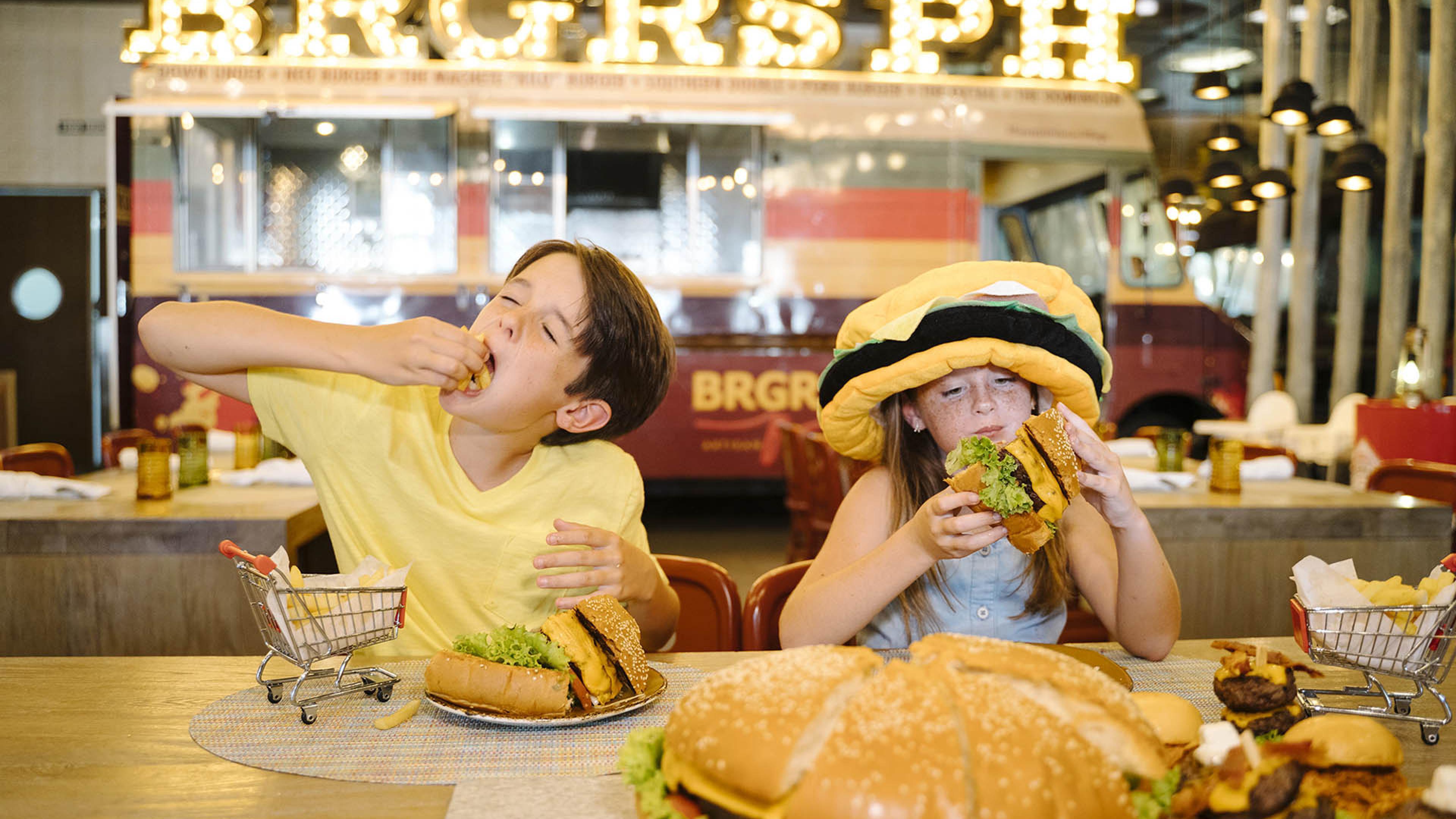 kids eating a hamburger