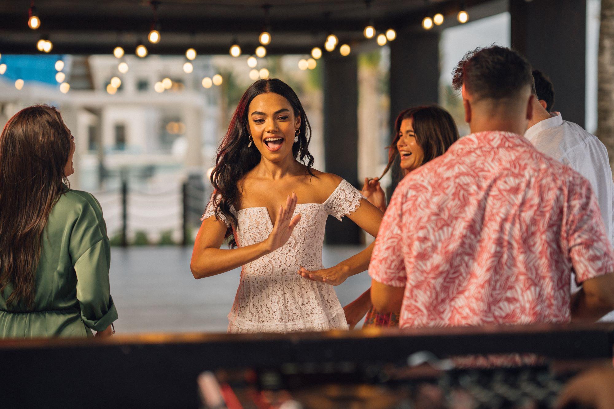 group of people dancing in a party